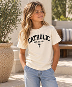 Catholic Varsity T-Shirt for Youth Girls: Natural shirt with black lettering