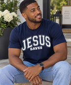Model wearing a dark blue Jesus Saves T-shirt with white varsity lettering.