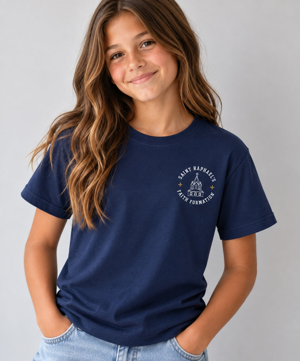 Saint Raphael’s Faith Formation youth T-shirt in navy, worn by a girl