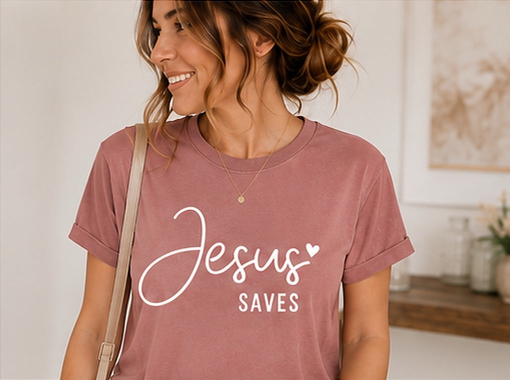 On-model mockup of a mauve T-shirt with the Jesus Saves design in white lettering.