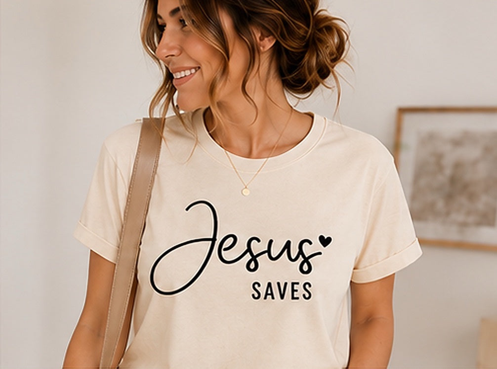 On-model mockup of a natural-colored T-shirt with the Jesus Saves design in black lettering.