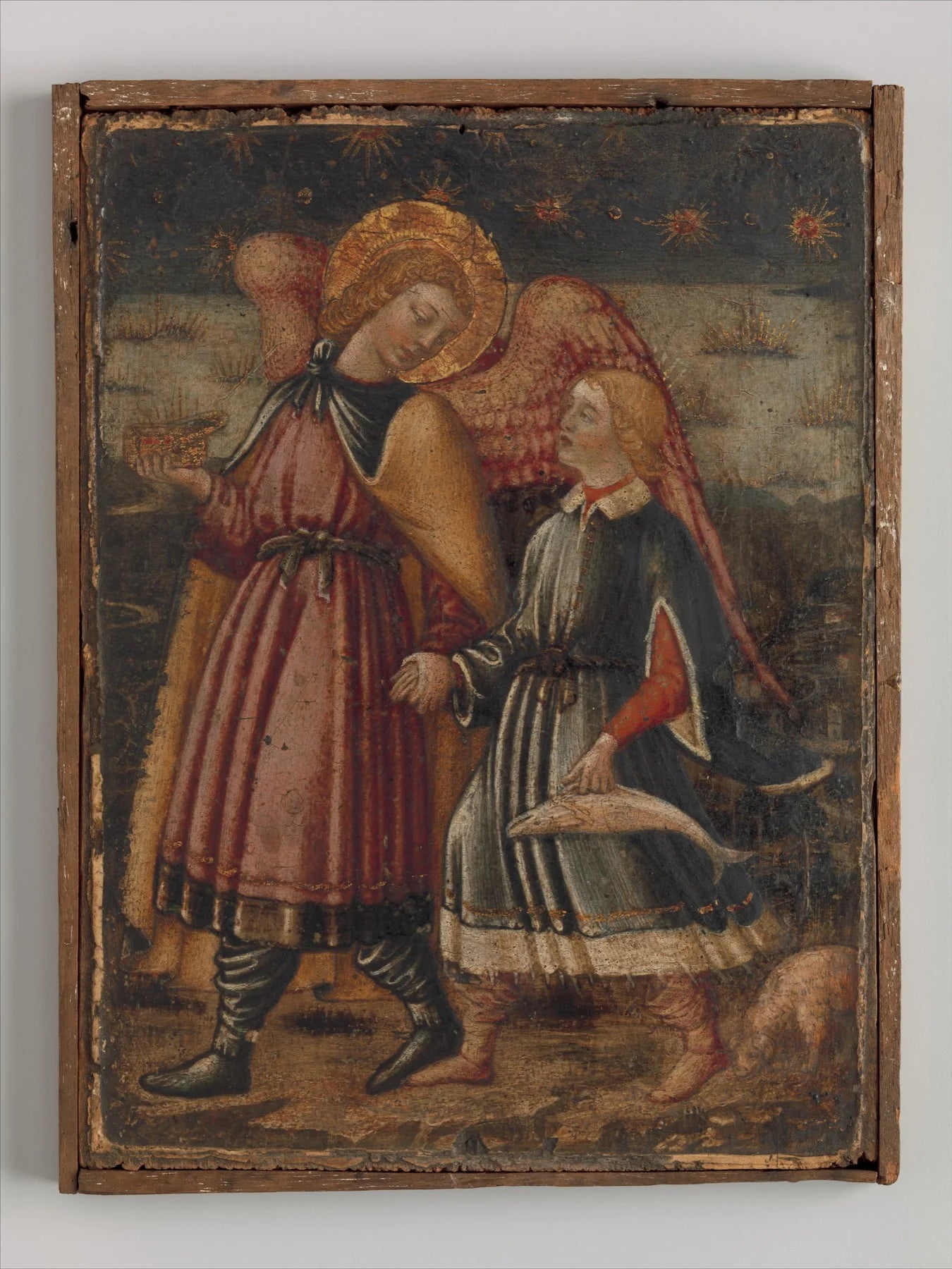 A fifteenth-century painting of the winged Raphael holding hands with Tobias, who carries a fish.